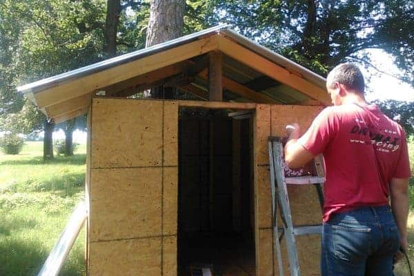 Make your own DIY chicken tractor using these plans and pallet wood. Easy step-by-step plans. From FrugalChicken