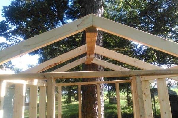 Make your own DIY chicken tractor using these plans and pallet wood. Easy step-by-step plans. From FrugalChicken