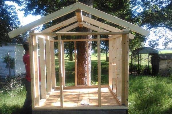 Make your own DIY chicken tractor using these plans and pallet wood. Easy step-by-step plans. From FrugalChicken