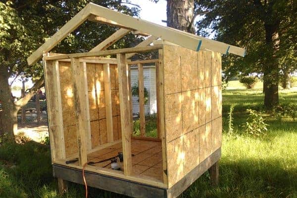 Make your own DIY chicken tractor using these plans and pallet wood. Easy step-by-step plans. From FrugalChicken