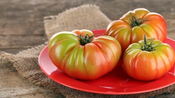Got lots to harvest and wondering how to ripen green tomatoes? Here's 3 ways!