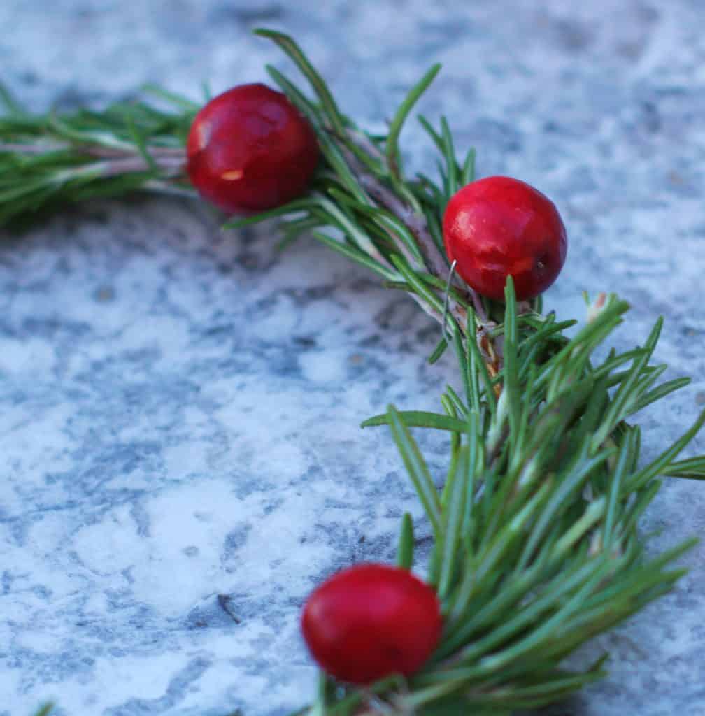 Make an easy DIY holiday wreath with herbs and berries for your backyard chicken coop!