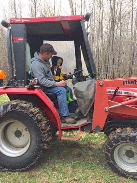 chicken farmer tractor with adult and child