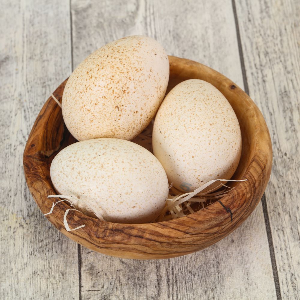 Turkey eggs in a wooden bowl